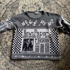 Stylish black and white sweater with newspaper print. design by Grace Adele
